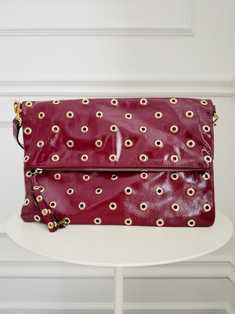 Grommet Detail Patent Leather Clutch