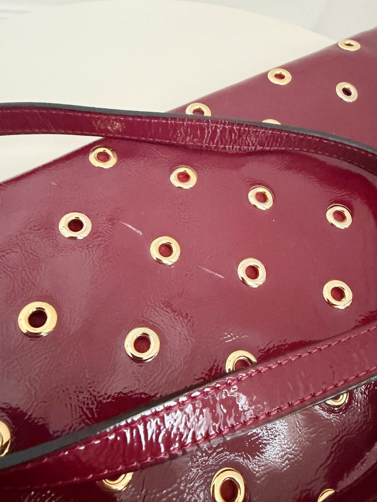 Grommet Detail Patent Leather Clutch
