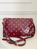 Grommet Detail Patent Leather Clutch