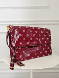 Grommet Detail Patent Leather Clutch