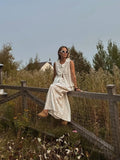 Eyelet Sleeveless Button-Down Top